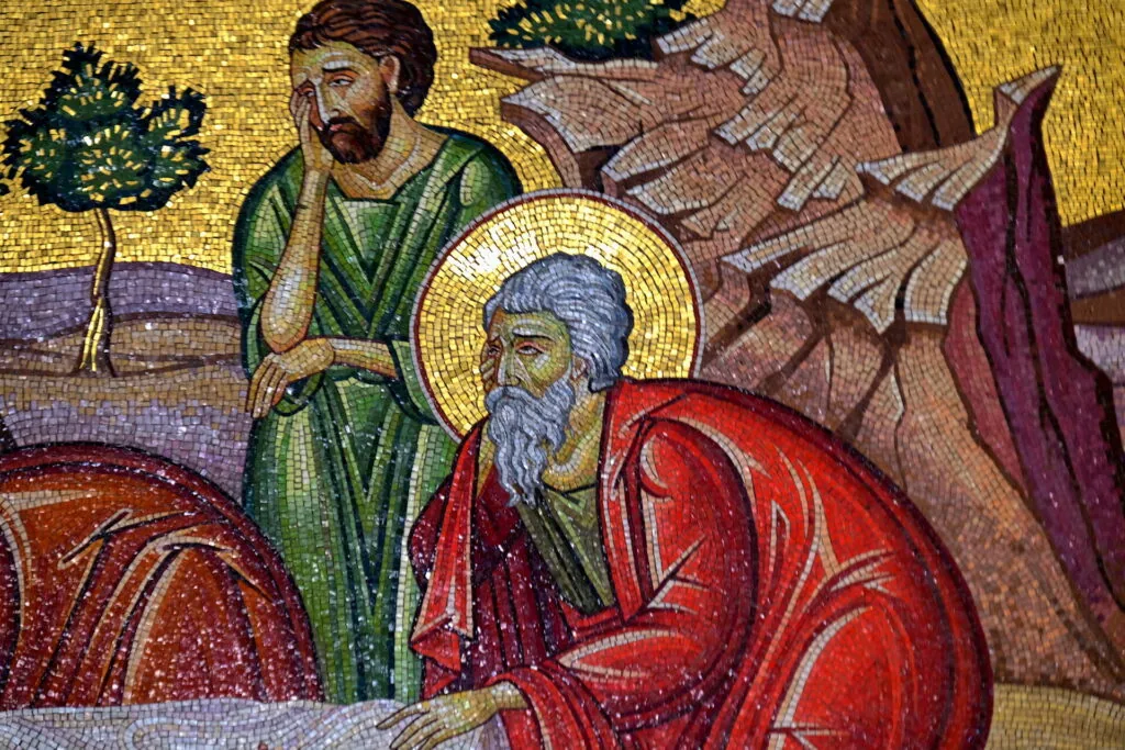 Byzantine mosaic depicting two haloed figures, one wearing red robes and one in green, with gold background and architectural elements
